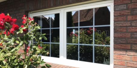 Einfamilienhaus, Teilansicht Fenster, Außenfolierung mit Sonnenschutzfolie durch Folien Fischer